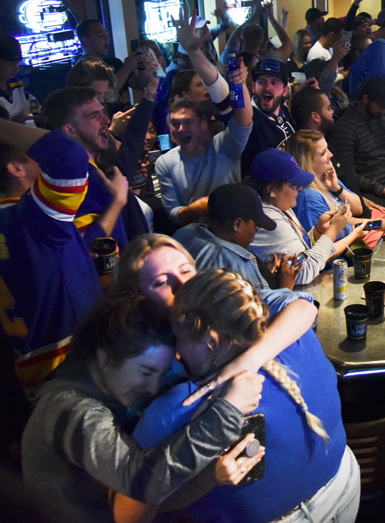 Friends huddled together on the outskirts of screaming fans